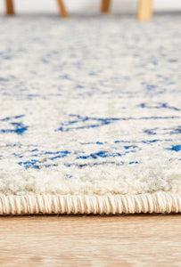 Evoke 258 White Rug with blue and grey highlights. Synthetic Machine Made Rug comes in Extra Large Sizes and Hall Runner