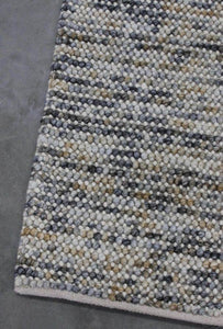 Magic Mineral Wool textured rug with wool loops knotted into a backing. Rug Addiction is a Stockist of The Rug Collection